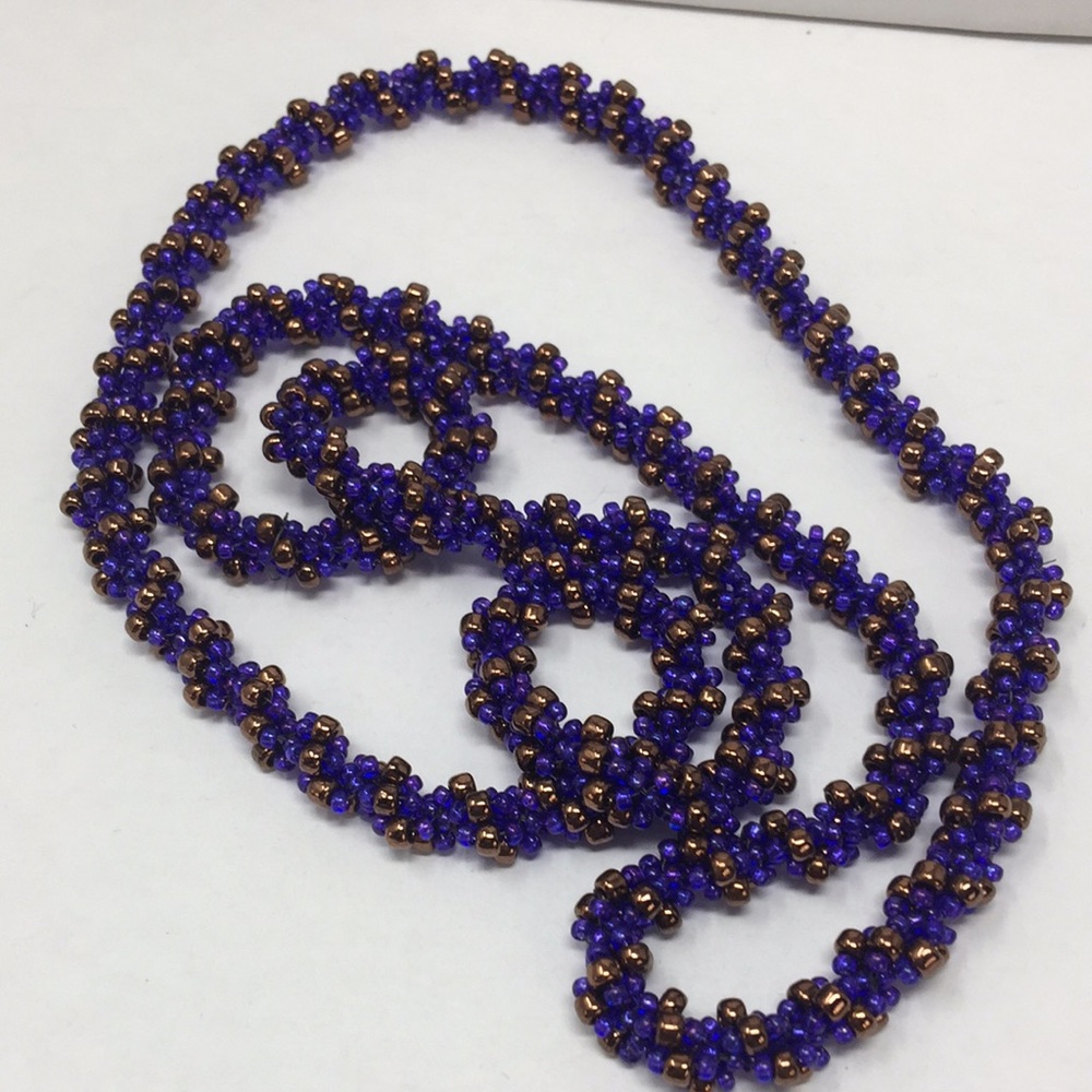 Hand Crafted bead woven necklace in purple & gold